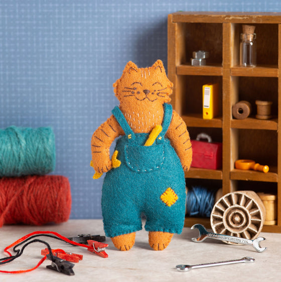 Corinne Lapierre Felt Craft Mini Kit. A ginger cat, wearing blue overalls,  stood with a yellow spanner in his hand. 
