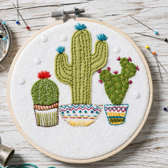Corinne Lapierre applique hoop felt craft kit. 3 cacti in pots, set in a wooden embroidery hoop.
