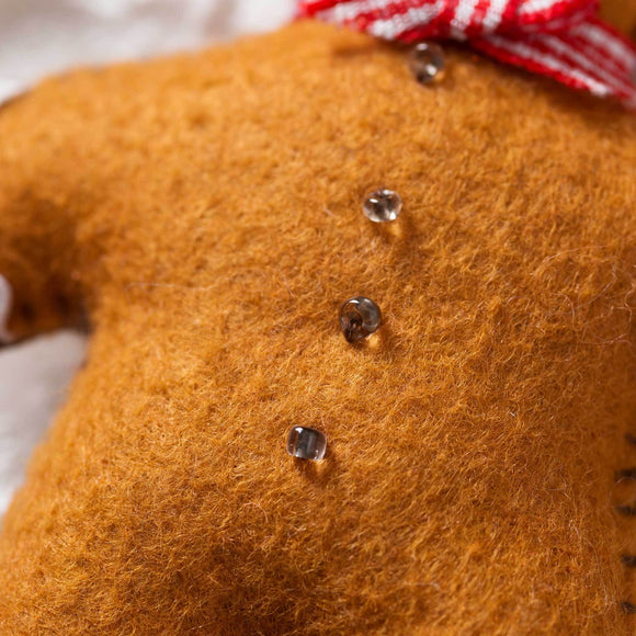 Corinne Lapierre Gingerbread Man Felt Craft Kit. Felt gingerbread man, wearing red & white gingham bow tie.