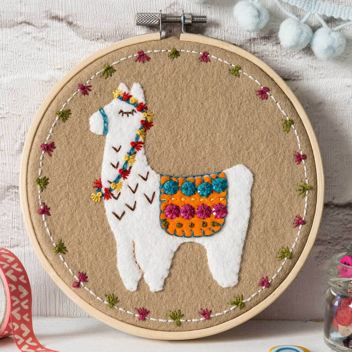 Corinne Lapierre applique hoop felt Llama craft kit. White felt Llama set in a wooden embroidery hoop.