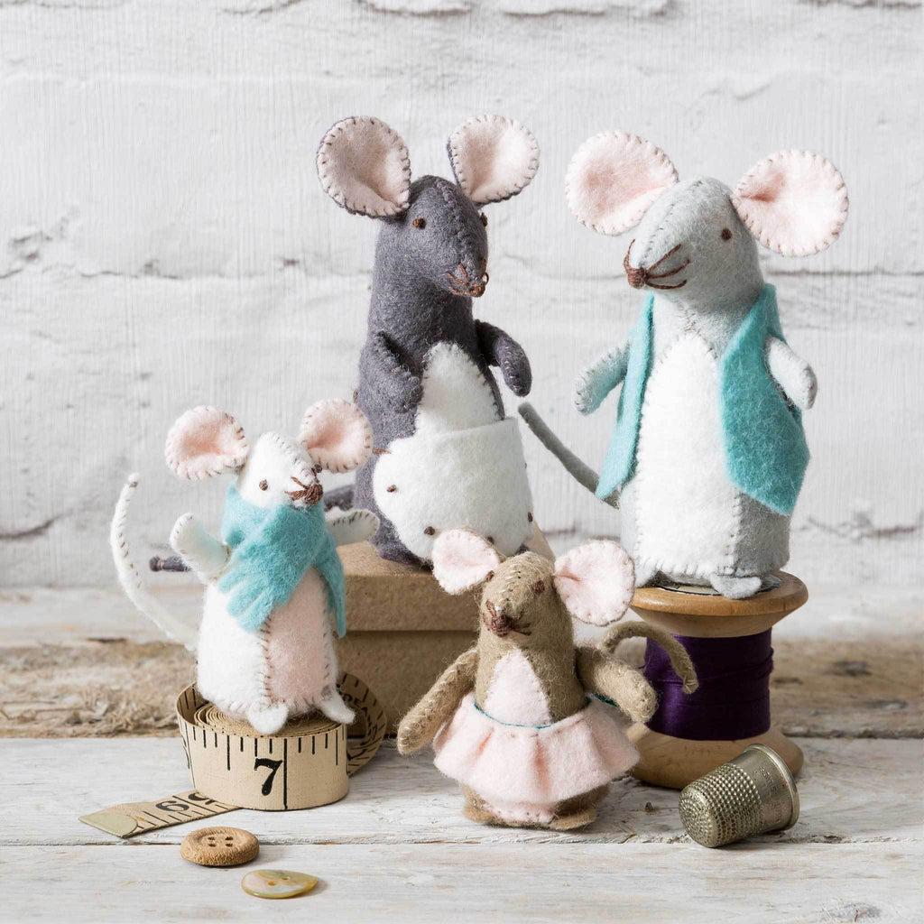 Corinne Lapierre Mouse Family Craft Kit. 4 mice wearing clothing and stood on sewing accessories.