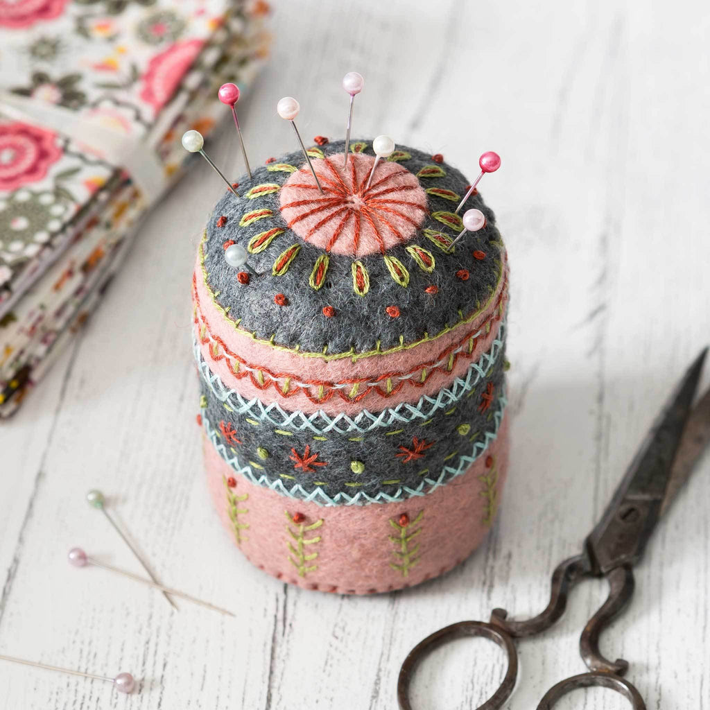 Corinne Lapierre Felt Pin Cushion Embroidery Craft Kit. Round tubular embroidered pin cushion in grey and pink felt.
