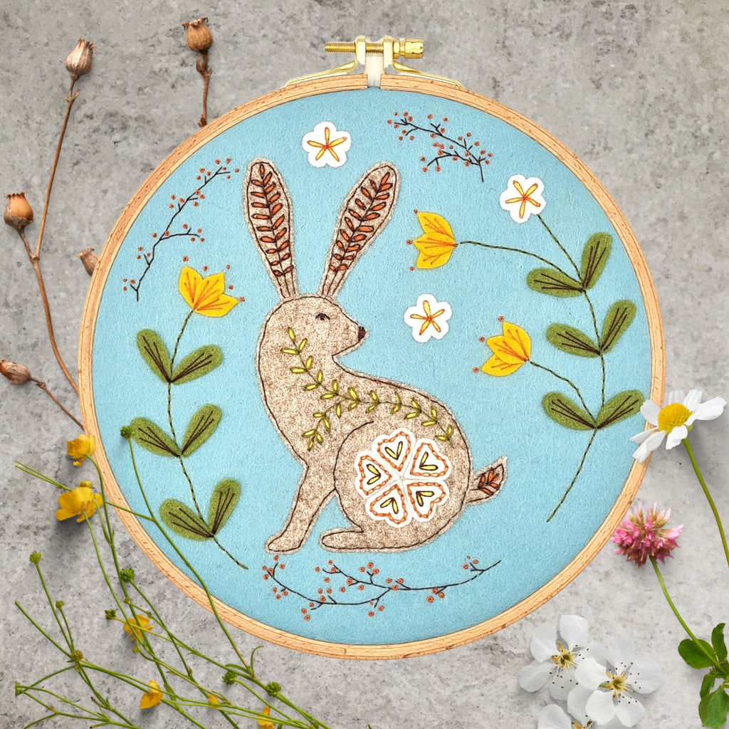 Corinne Lapierre applique hoop felt wild hare craft kit. Fawn hare & yellow flowers, set in a wooden embroidery hoop.