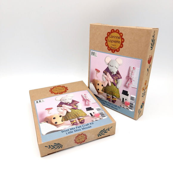 Corinne Lapierre Felt Craft Mini Kit. A mouse character is stood wearing a green dress and purple shawl and shoes. She is holding a pale pink teddy.. 