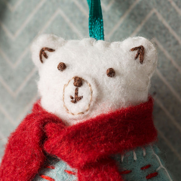 Corinne Lapierre Polar Bear Felt Craft Kit. Polar bear wearing a turquoise jumper and red scarf.