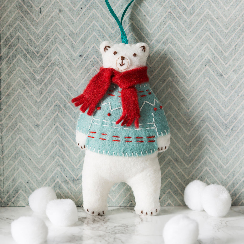 Corinne Lapierre Polar Bear Felt Craft Kit. Polar bear wearing a turquoise jumper and red scarf.