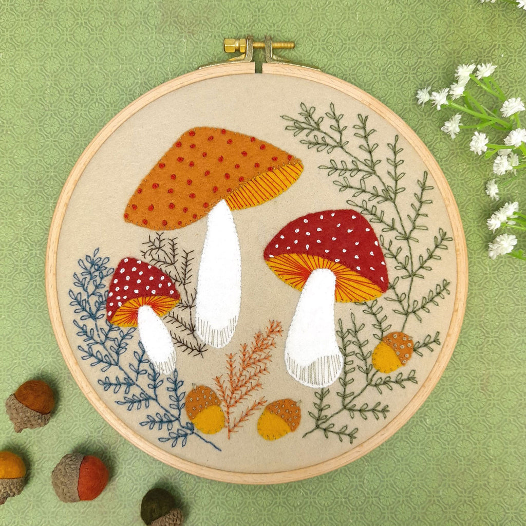 Corinne Lapierre applique hoop felt toadstool craft kit. 3 felt toadstools set in a wooden embroidery hoop.