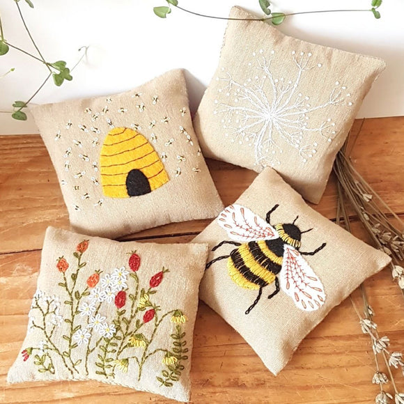Corinne Lapierre Embroidered Linen Lavender bags with bees and flowers. 4 light beige lavender bags with botanical embroidered motifs. Including flowers, bees and bee hive.